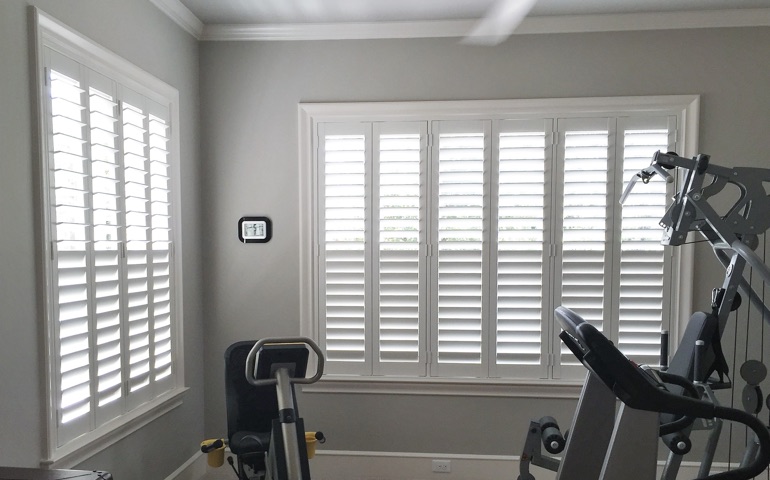 Las Vegas home gym with shuttered windows.